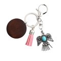 Bohemian eagle keychain with pink tassel and round wooden pendant in vintage silver - Pink