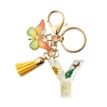 Resin key ring with letter Y featuring dried yellow flowers, butterfly and tassel charm - Letter Y