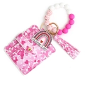 Detalle de cartera de corazón en cuero PU con pulsera de cuentas de silicona - Corazón Rosa Melocotón