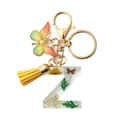Resin letter Z keychain with dried white flowers, yellow tassel, and butterfly charm - Letter Z