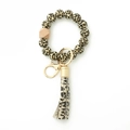 Bracelet porte-clés en perles de silicone léopard avec perle en bois et pompon - 5 Motif Léopard Jaune