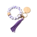 Llavero de pulsera con cuentas de silicona con flores moradas, madera y borla larga - Porcelana Azul y Blanca