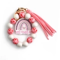 Portachiavi bracciale Mama in perle rosa e bianche con cuore arcobaleno e nappa - Rosso Anguria (Perlina in Puro Legno)