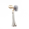 Chic keychain with a grey plush pompom and light grey PU leather tassel in golden finish - Tassel With Fur Ball (C5) / Silver