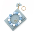 Light blue faux leather wallet with butterfly charm and blue silicone bead wristlet strap - Light Blue