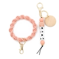 Pink braided wristlet keychain with MAMA letter beads and round wooden tag charm - Pink