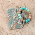 Macro detail of tricolor woven wallet keychain with silicone bead wristlet strap - Woven Green