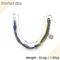 Dettaglio di un portachiavi in pelle intrecciata da 40cm con ciondolo a sole e catena in metallo - Giallo Grigio (Ciondolo Sole)
