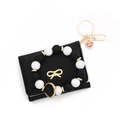 Black leather wallet with gold butterfly and black-and-white silicone bead wristlet strap - Black With Silicone Bracelet