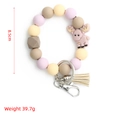 Bracciale portachiavi in silicone Morandi con ciondolo alce rosa e nappa in pelle beige - Alce (S4) / Alce Viola Chiaro