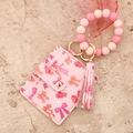 Cartera rosa con lazos, pulsera de cuentas de silicona y llavero con borla elegante - Lazo rosa
