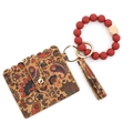 Tarjetero de corcho con estampado paisley, pulsera de cuentas rojas y borla - Planta Rojo Ladrillo