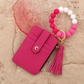 Macro detail of rose red lychee leather card holder with silicone bead wristlet strap - Rose Red