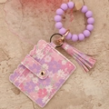 Purple floral card holder keychain with silicone beads and pink tassel accent - Purple