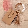 Close-up of khaki leather card wallet with silicone beaded wristlet and elegant tassel - Khaki