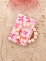 Porte-cartes rose à motif nœud avec bracelet en perles silicone et anneau doré - Noeud rose clair