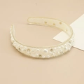 Detailed macro view of an ivory baroque wide headband with pearls and rhinestones - Clear Base White