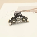Baroque hair claw clip with pearls and rhinestones on elegant white display tray - Black Pearl Rhinestone Flower (Main Image Model)