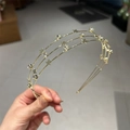 Elegant gold metal headband featuring layered stars and sparkling rhinestones for women - Gold