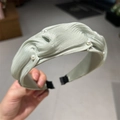 Elegant light green pleated headband with faux pearl accents and high crown design - Green