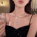 Close-up of a silver-tone double-layer zircon choker with a teardrop-shaped pendant charm - Silver Water Drop Necklace