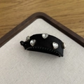 Detail of black velvet banana hair clip with five sparkling heart-shaped rhinestones - Heart Rhinestone Style