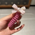 Pink marble acetate spiral hair tie with a handmade bow for high ponytail styling - Rose Red