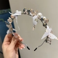 Elegant headband with champagne crystals, white pearls, and floral fabric petals - Champagne And Blue Crystal Style (Main Image Style)