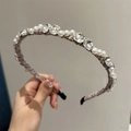 Close-up of woven grey headband with white pearls and faceted crystals details - Dusty Pink