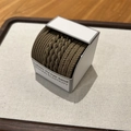 Close-up of coffee brown braided high elasticity hair bands in minimalist white packaging - Brown
