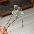 Detailed close-up of butterfly hair pin with crystal wings and gold metal tassel accents - Full Rhinestone Butterfly (U-Shape)
