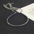 Close-up of blue velvet choker necklace with tiered silver chains and crystal beads - Gray