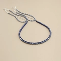 Detail of handcrafted blue crystal bead headband with silver fringe and woven texture - Blue