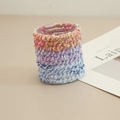 Close-up of three knitted elastic hair bands with woven texture in pastel color palette - Seamless Hair Tie / Colorful