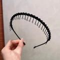 Detail view of black beaded headband with metal chain fringe and modern resin texture - Black