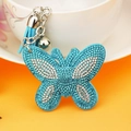 Glinsterende vlinder sleutelhanger met blauwe strass-steentjes en een blauwe kwastje - 65*55mm / Meerblauw