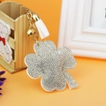 Sparkling four-leaf clover keychain with silver rhinestones, gold chain and white tassel - White Base White Rhinestone