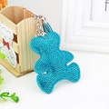 Sky blue rhinestone bear keychain with tassel charm and silver ring on white table - Lake Blue