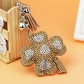 Sparkling four-leaf clover keychain with rhinestones, silver bell and brown tassel charm - Khaki