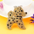 Detailed view of yellow rhinestone teddy dog keychain with sparkling crystal embellishments - Khaki