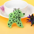 Porte-clés chien en strass vert avec pompon élégant pour sacs à main de femme - Vert clair