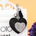 Portachiavi a cuore bicolore con strass neri e bianchi, campanellino argento e nappa pendente - Cuore nel Cuore Bianco e Nero / Nero
