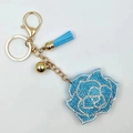 Sky blue rose keychain with sparkling rhinestones, tassel, and golden bell hardware - Lake Blue