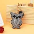 Close-up of sparkling owl keychain with black tassel and golden hardware detail - 60*50 / Dark Gray