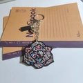 Chic multi-color crystal rose keychain with a black tassel and small silver bell - Multi-color