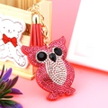 Close-up of pink owl keychain featuring sparkling rhinestones and a red tassel detail - 60*50 / Watermelon red