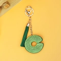 Close-up of green rhinestone letter C keychain with a matching suede tassel and silver clasp - Emerald Green Letter C Style (P0095)