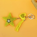 Detailed view of yellow rhinestone star keychain with heart charm and matching tassel - Pentagram