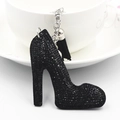 Detailed view of black rhinestone high heel keychain with elegant tassel and silver chain - Silver & Black