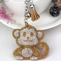 Cute monkey keychain with champagne rhinestones, brown tassel and silver bell detail - Khaki